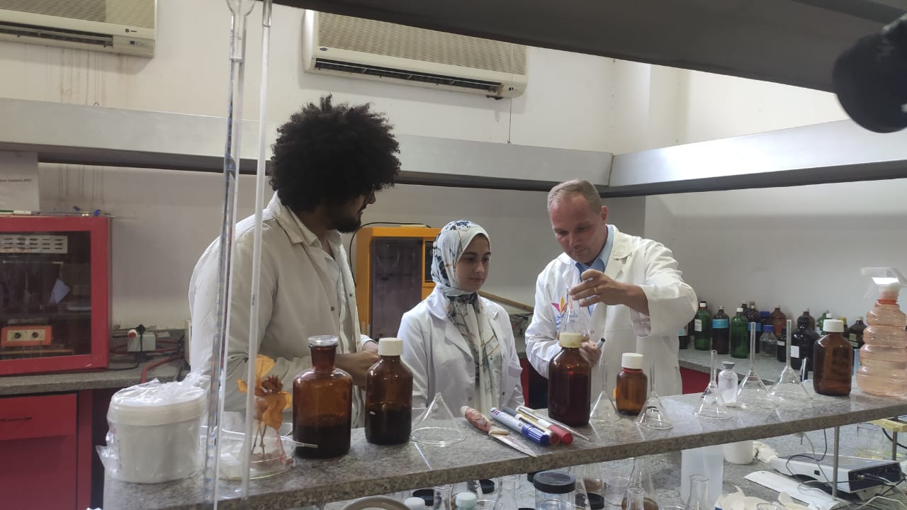 Professor with students in lab